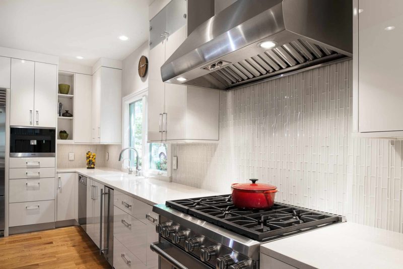 Chrome and Cream 3 beautiful and functional kitchen with vented gas range cooking