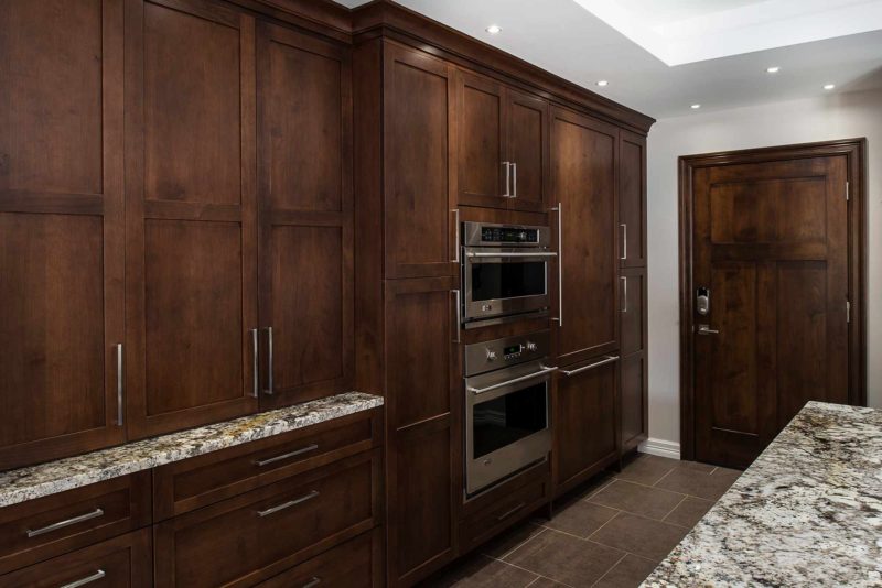 Dark Industrial 6 Handsome and rich kitchen with tall pantry storage and double ovens