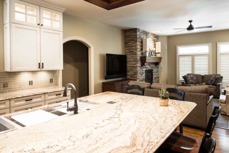 Marble & Wood 1 old world kitchen with island open to living room