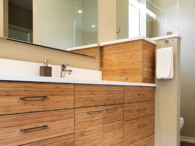 Beyond the Kitchen 3 modern bathroom counter with wood grain cabinets