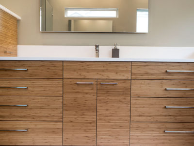 Beyond the Kitchen 4 modern bathroom counter with wood grain cabinets and modern vanity mirror