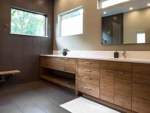 Beyond the Kitchen 7 modern bathroom counter with wood grain cabinets and modern vanity mirror