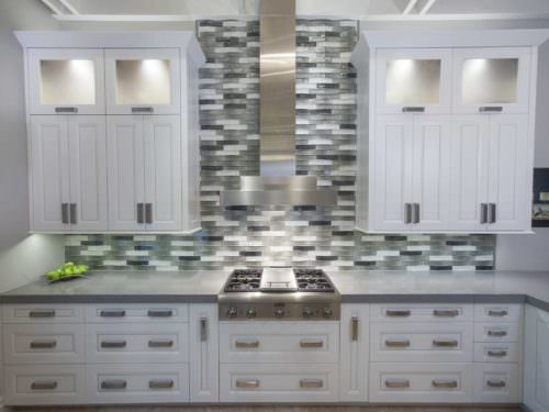 Leaves You Jonesin 2 contemporary kitchen with Thermador gas range top, vent hood above and tile backsplash
